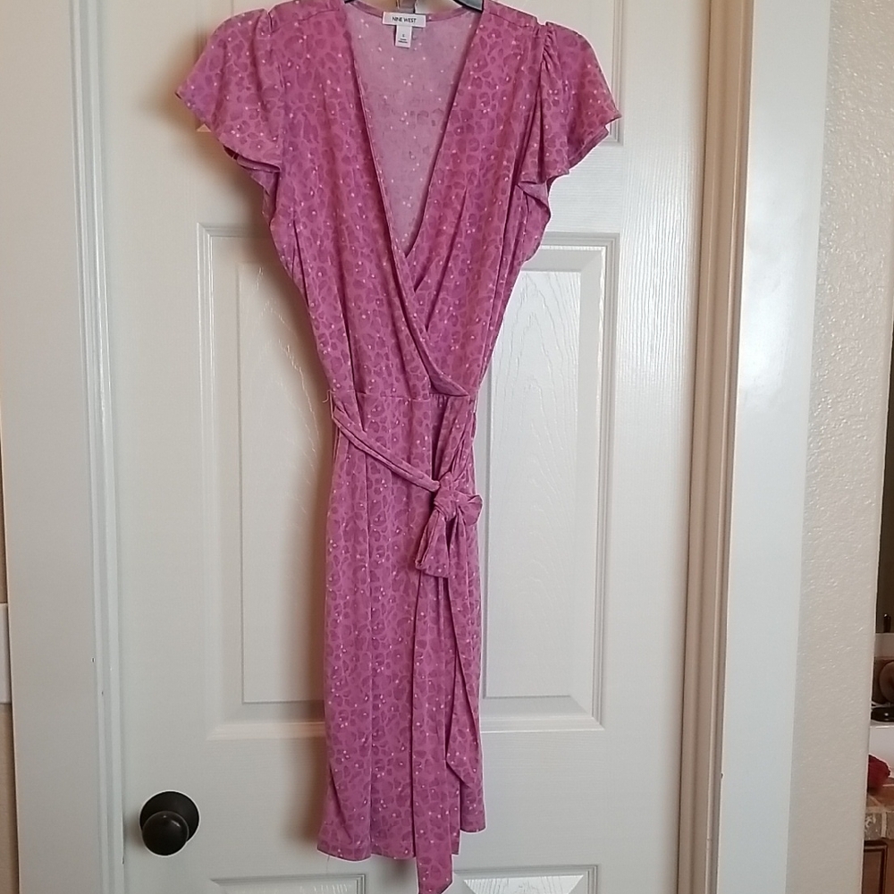 Wrap-Style Feminine Warm Pink Dress With Subtle Leopard Print in Background